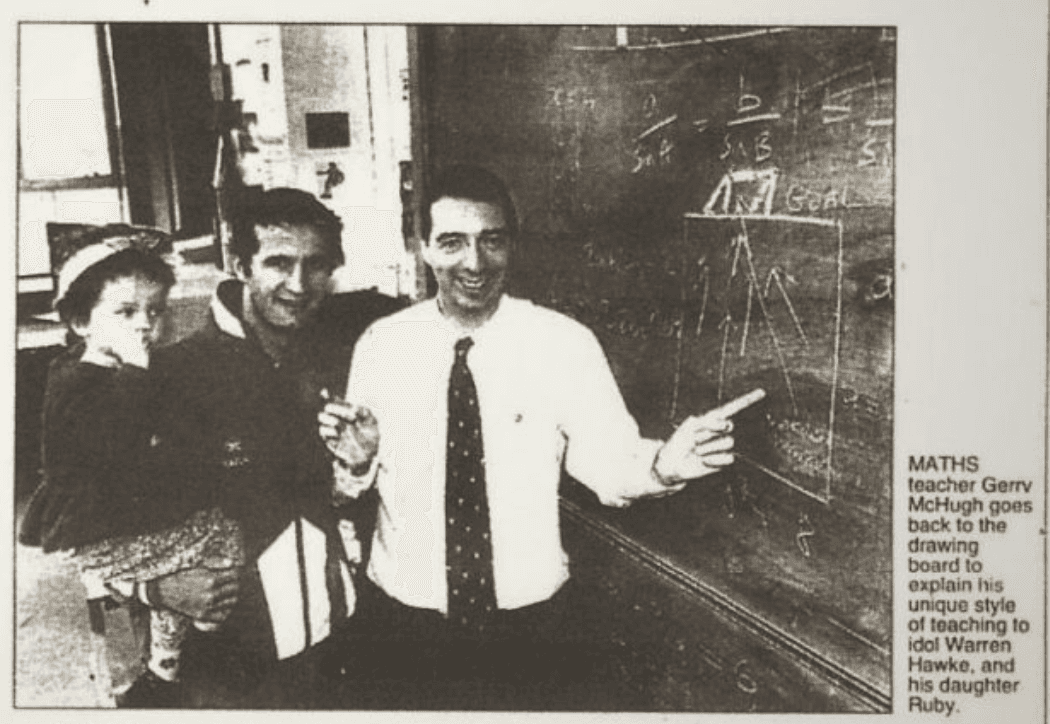 Gerry McHugh at the chalkboard with Morton player Warren Hawke